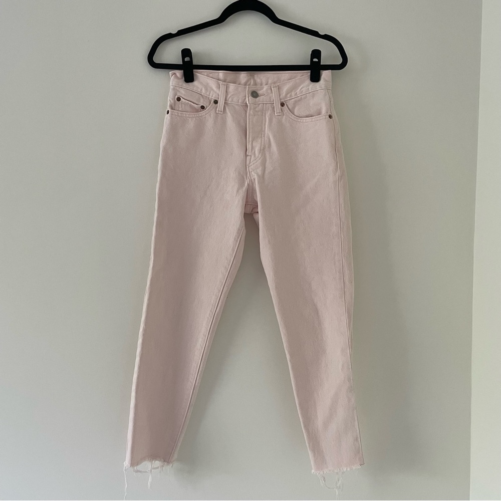 Pale pink Levi’s jeans